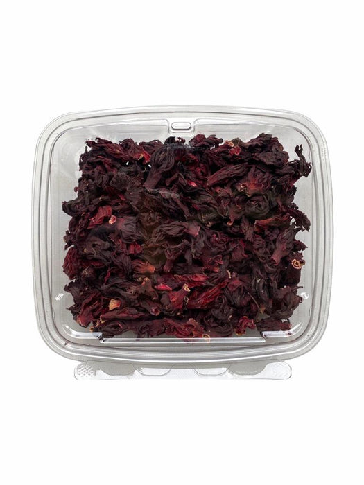 Vibrant dried hibiscus flowers in a clamshell container. AFRIVANA African Superfoods